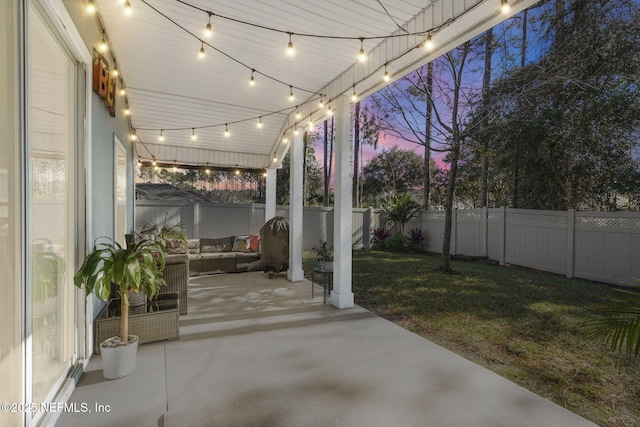 patio terrace at dusk with a lawn