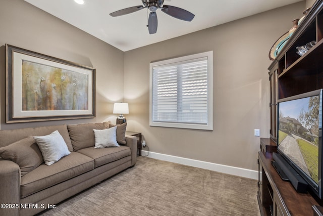 living room with ceiling fan and carpet flooring