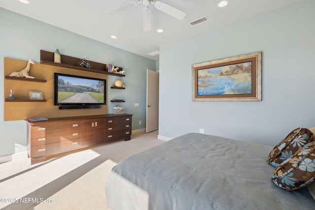 bedroom with ceiling fan and light colored carpet