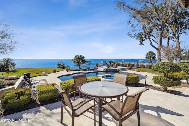 view of patio with a water view