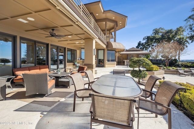 view of patio / terrace featuring ceiling fan and outdoor lounge area