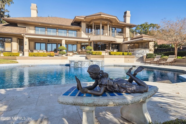 view of swimming pool featuring a patio