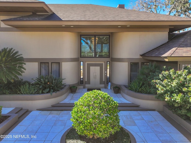 doorway to property with a patio area