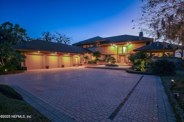 prairie-style home featuring a garage