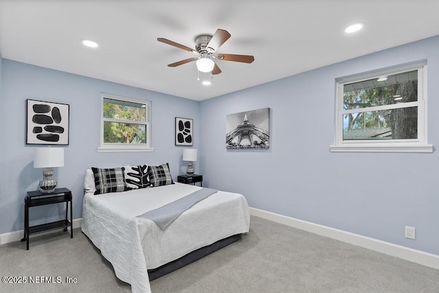 carpeted bedroom featuring ceiling fan