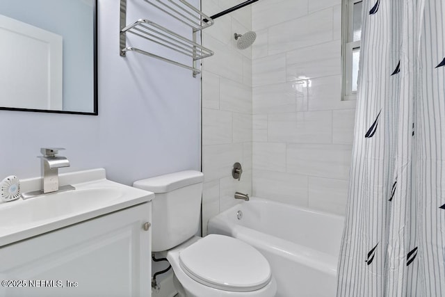 full bathroom featuring toilet, vanity, and tiled shower / bath combo