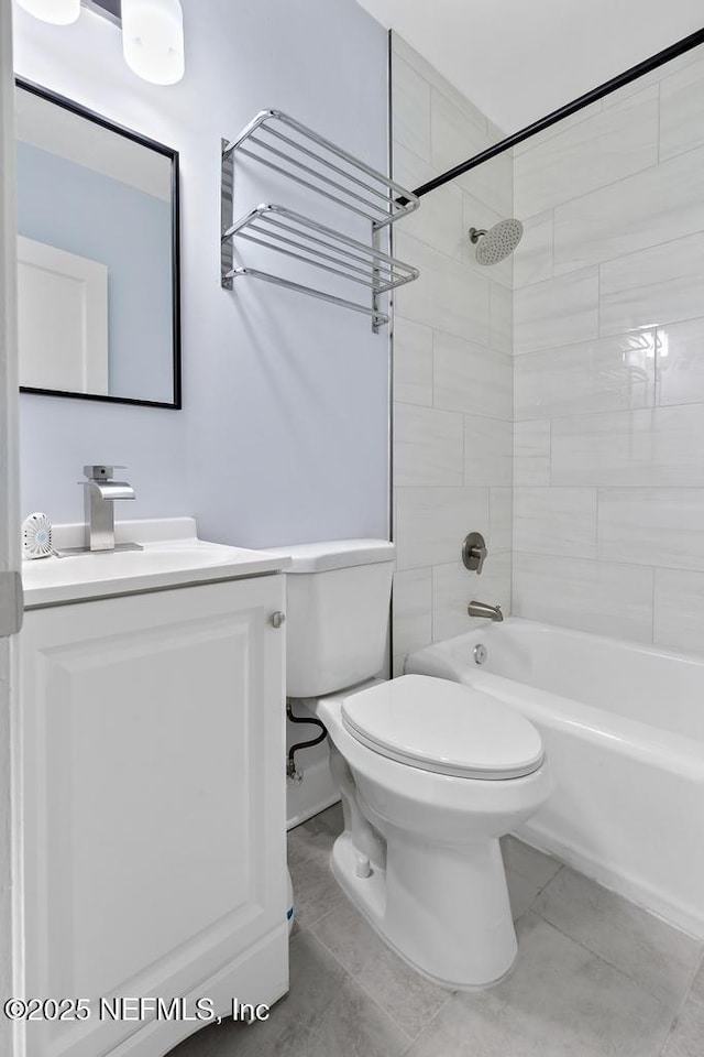 full bathroom with vanity, toilet, and tiled shower / bath combo