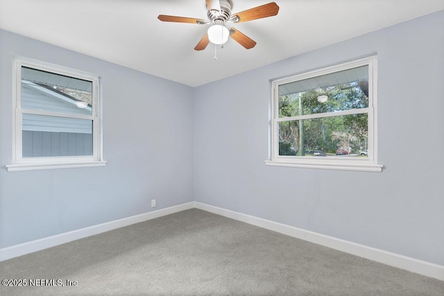 empty room featuring carpet and ceiling fan