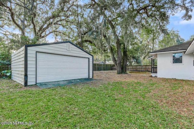 garage featuring a yard