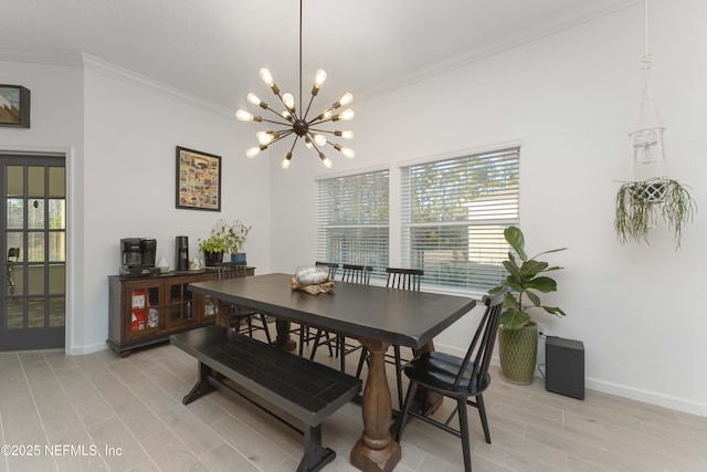 dining area featuring an inviting chandelier and ornamental molding