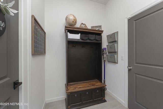 mudroom with light tile patterned flooring