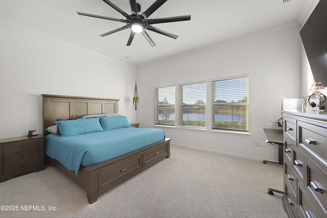 carpeted bedroom with ceiling fan and crown molding