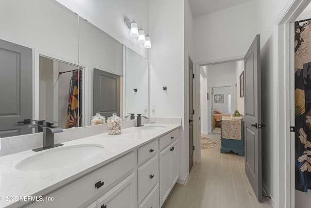 bathroom featuring vanity and hardwood / wood-style flooring