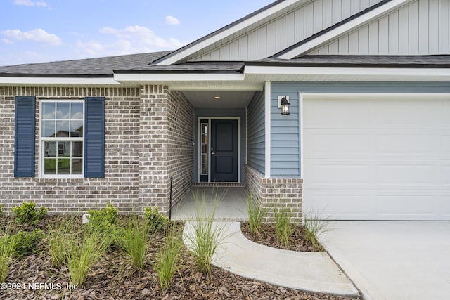 doorway to property featuring a garage