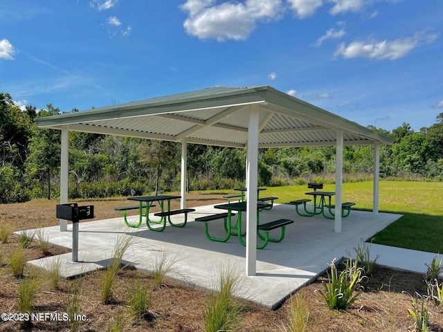 surrounding community with a gazebo and a lawn