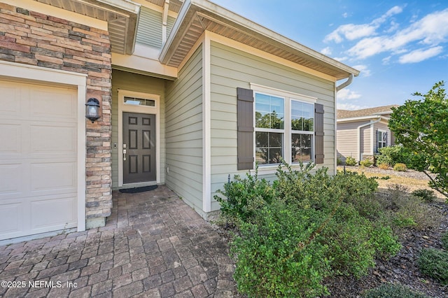 entrance to property featuring a garage