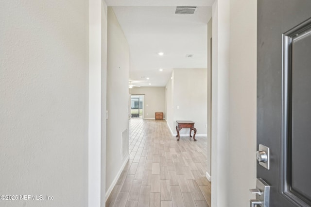 hallway featuring light wood-type flooring