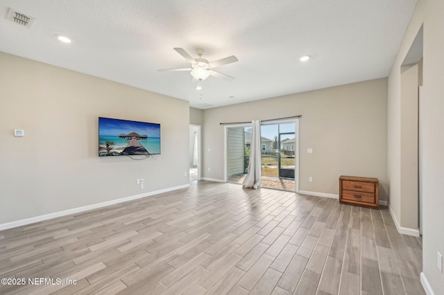 unfurnished living room with light hardwood / wood-style floors and ceiling fan