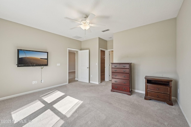 unfurnished bedroom with ceiling fan and light carpet