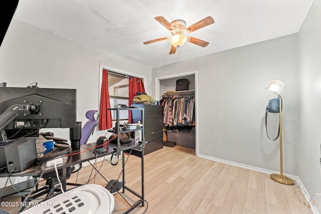 office area with ceiling fan and light hardwood / wood-style floors