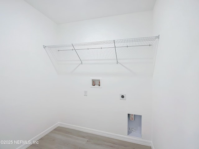 laundry area featuring washer hookup, hookup for an electric dryer, and wood-type flooring