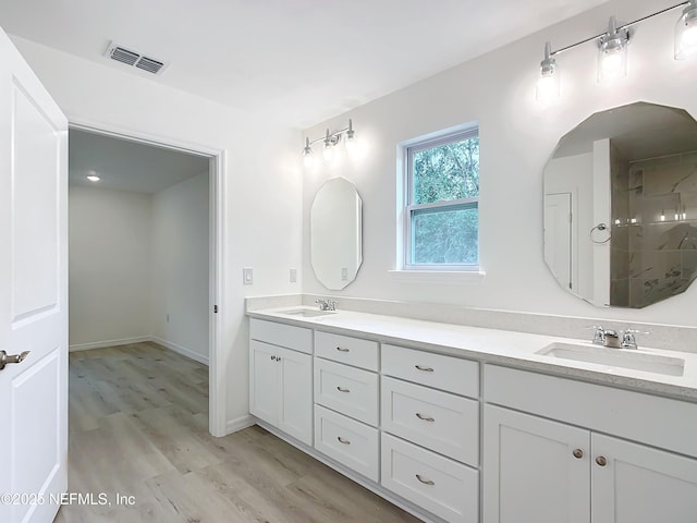 bathroom featuring vanity and hardwood / wood-style floors