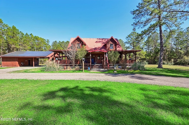 log cabin featuring a front yard and covered porch