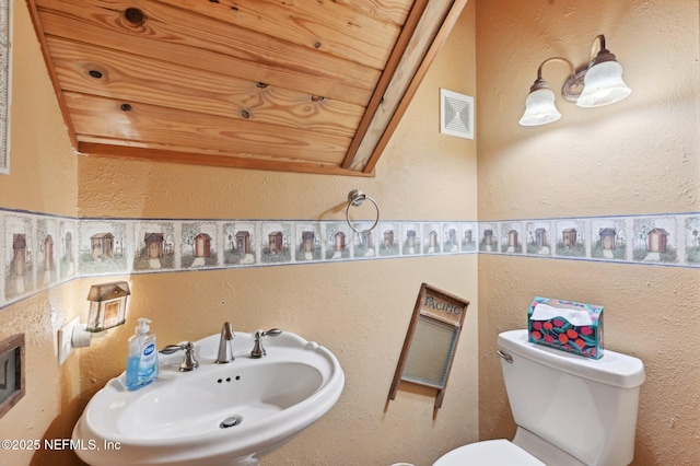 bathroom featuring sink and toilet