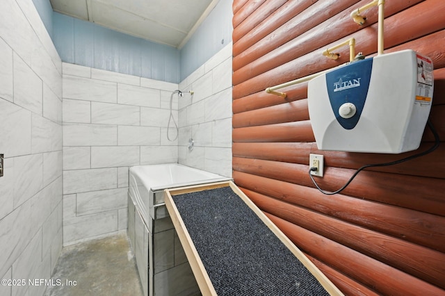 bathroom featuring rustic walls and a shower