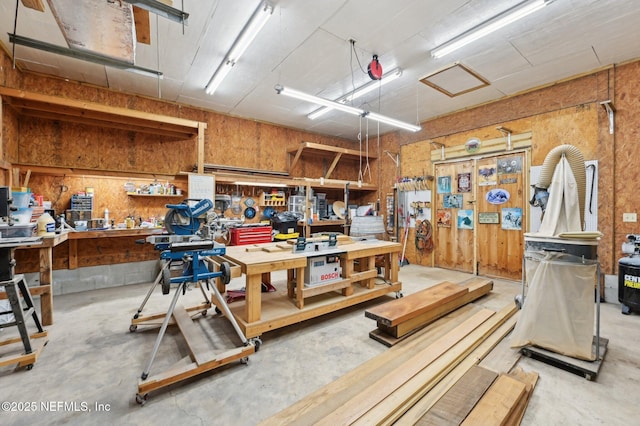 misc room featuring concrete floors and a workshop area