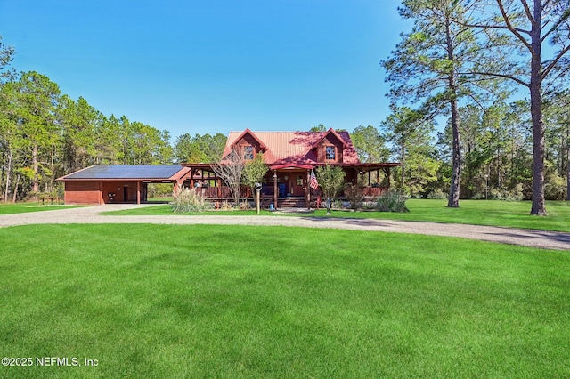 log cabin featuring a porch and a front yard