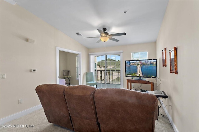 living room featuring ceiling fan, light colored carpet, and lofted ceiling