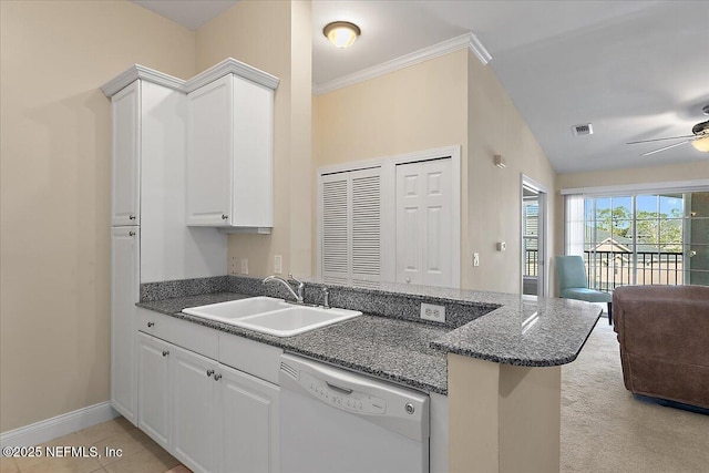 kitchen with kitchen peninsula, ceiling fan, sink, dishwasher, and white cabinetry