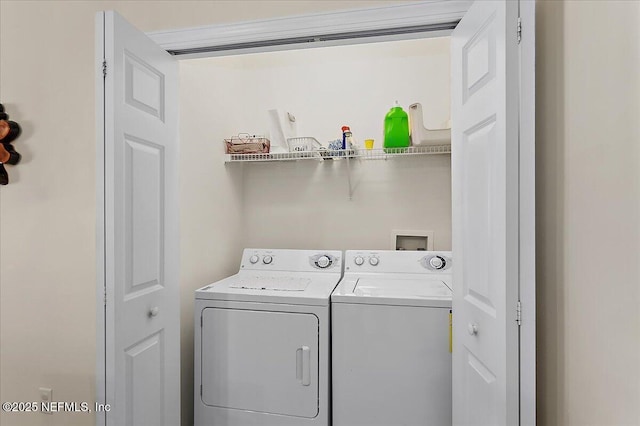 laundry room with separate washer and dryer