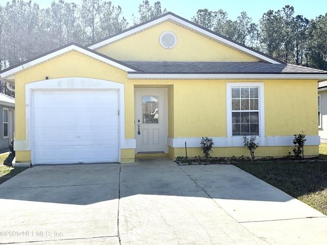 single story home featuring a garage