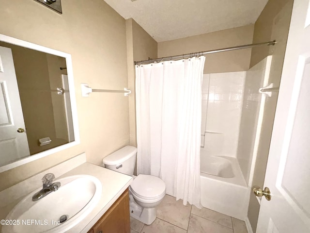 full bathroom featuring shower / tub combo, tile patterned floors, vanity, a textured ceiling, and toilet