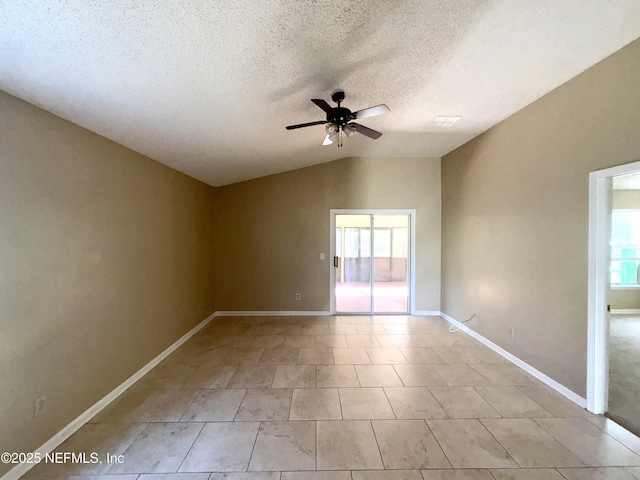 spare room with plenty of natural light, ceiling fan, lofted ceiling, and a textured ceiling