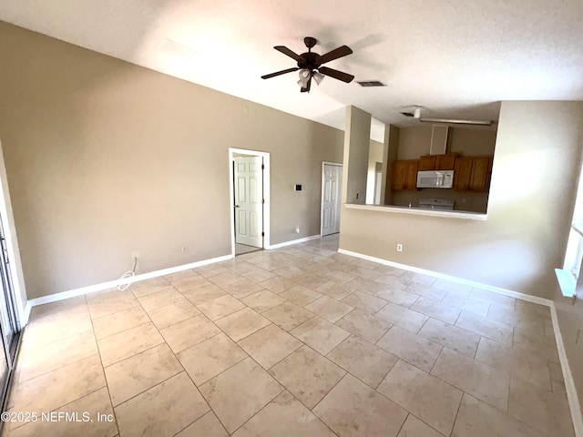 unfurnished living room with ceiling fan and a textured ceiling