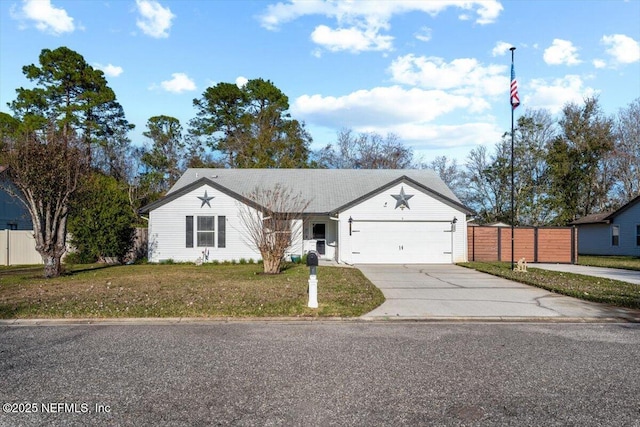 ranch-style house featuring a front yard and a garage