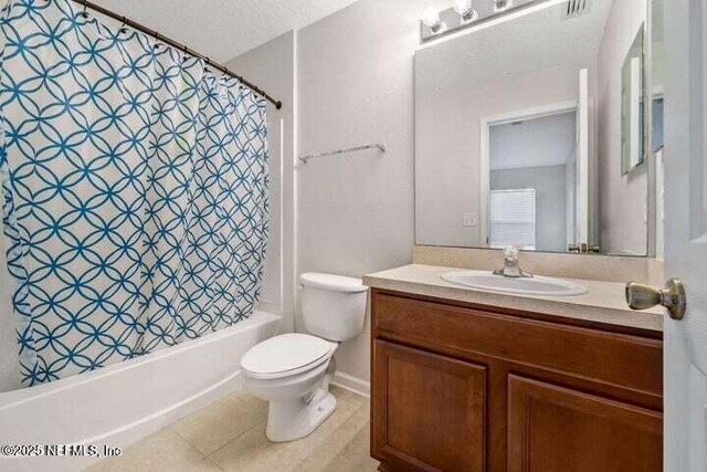 full bathroom featuring vanity, toilet, a textured ceiling, and shower / tub combo with curtain