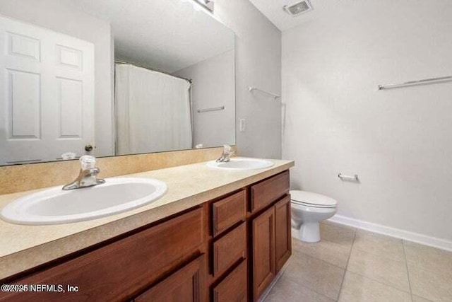 bathroom with curtained shower, tile patterned flooring, a textured ceiling, toilet, and vanity