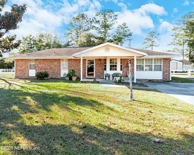 single story home with a porch and a front yard