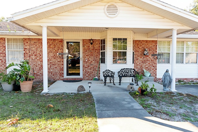 property entrance with covered porch