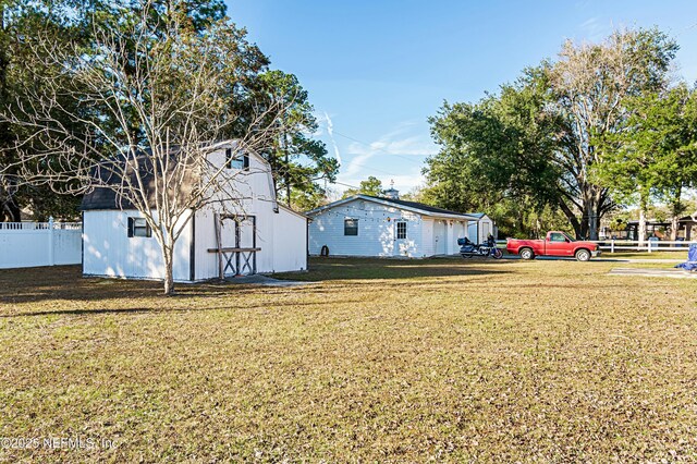 exterior space featuring a yard and a shed