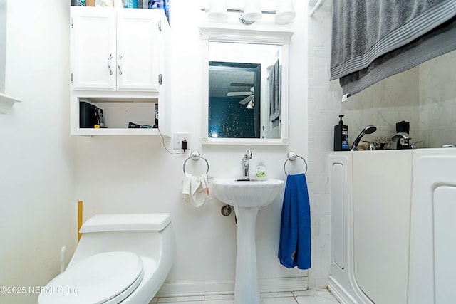 bathroom featuring tile patterned floors and toilet