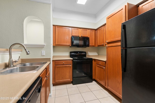 kitchen featuring crown molding, sink, light tile patterned floors, and black appliances