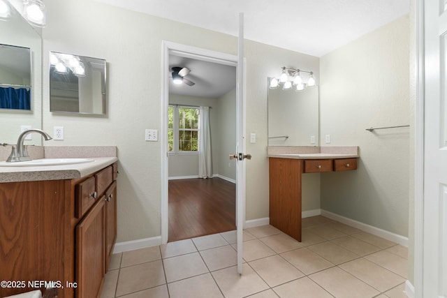 bathroom with ceiling fan, tile patterned flooring, and vanity