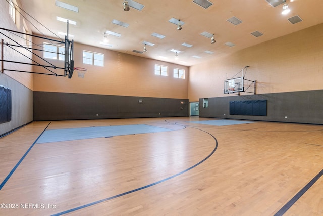 view of basketball court featuring a wealth of natural light