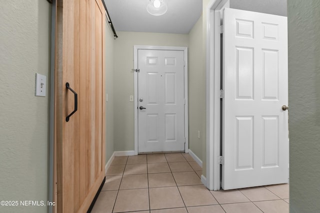 entryway featuring light tile patterned floors