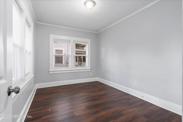 unfurnished room with a textured ceiling, ornamental molding, and dark wood-type flooring